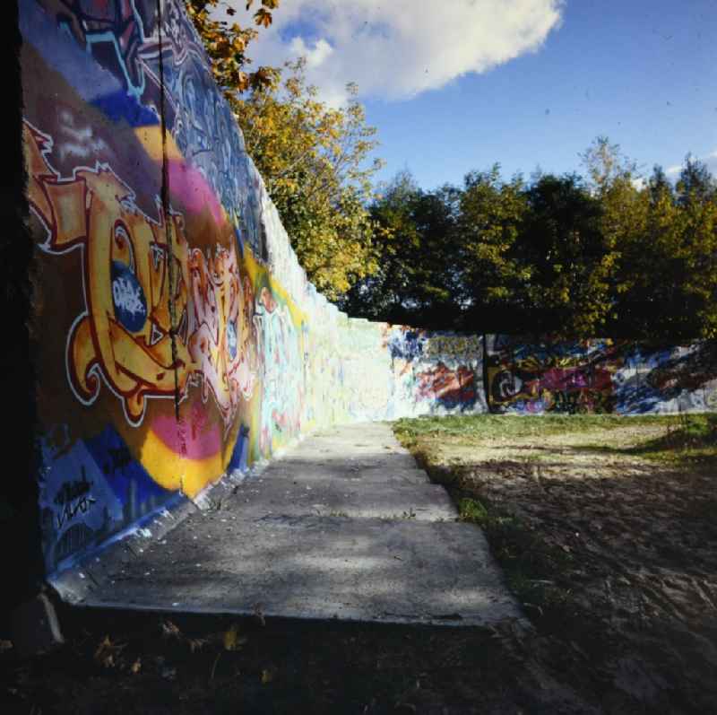 Border security fortifications with graffiti paintings in Potsdam in the state Brandenburg on the territory of the former GDR, German Democratic Republic