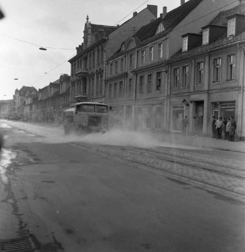 Water truck truck Skoda Liaz MTS 24 during the street cleaning of Friedrich-Ebert-Strasse in the district Innenstadt in Potsdam in the state Brandenburg in the area of the former GDR, German Democratic Republic
