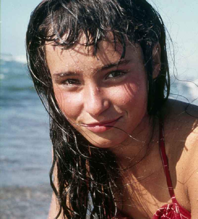 Young girl has a bath in the Baltic Sea in Prerow in the federal state Mecklenburg-West Pomerania in the area of the former GDR, German democratic republic