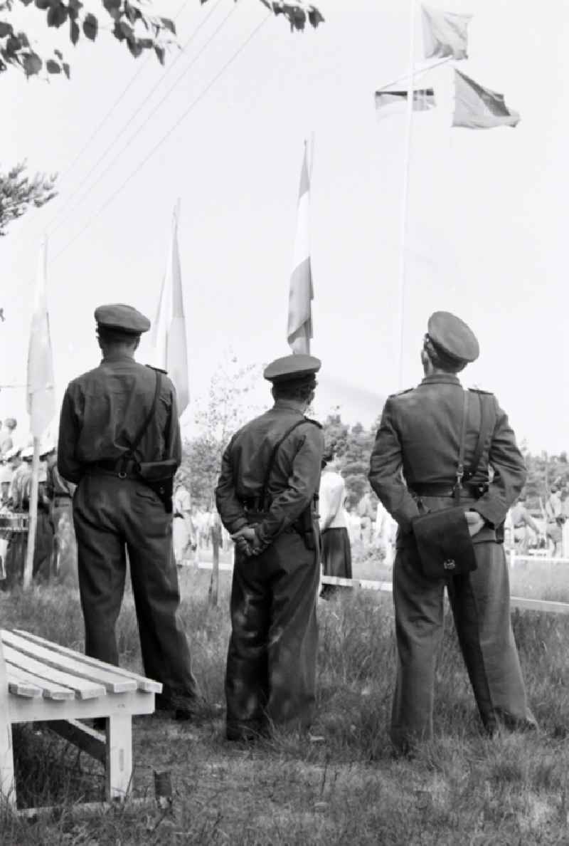 Summer camp operation with pupils and teenagers in the summer camp 'Kim Ir Sen' of the pioneer organization 'Ernst Thaelmann' in Prerow in the state Mecklenburg-Western Pomerania on the territory of the former GDR, German Democratic Republic. With homemade phantasy uniforms and pre-military drill and ante-exercises, the communist tradition was commemorated in the Spanish Civil War