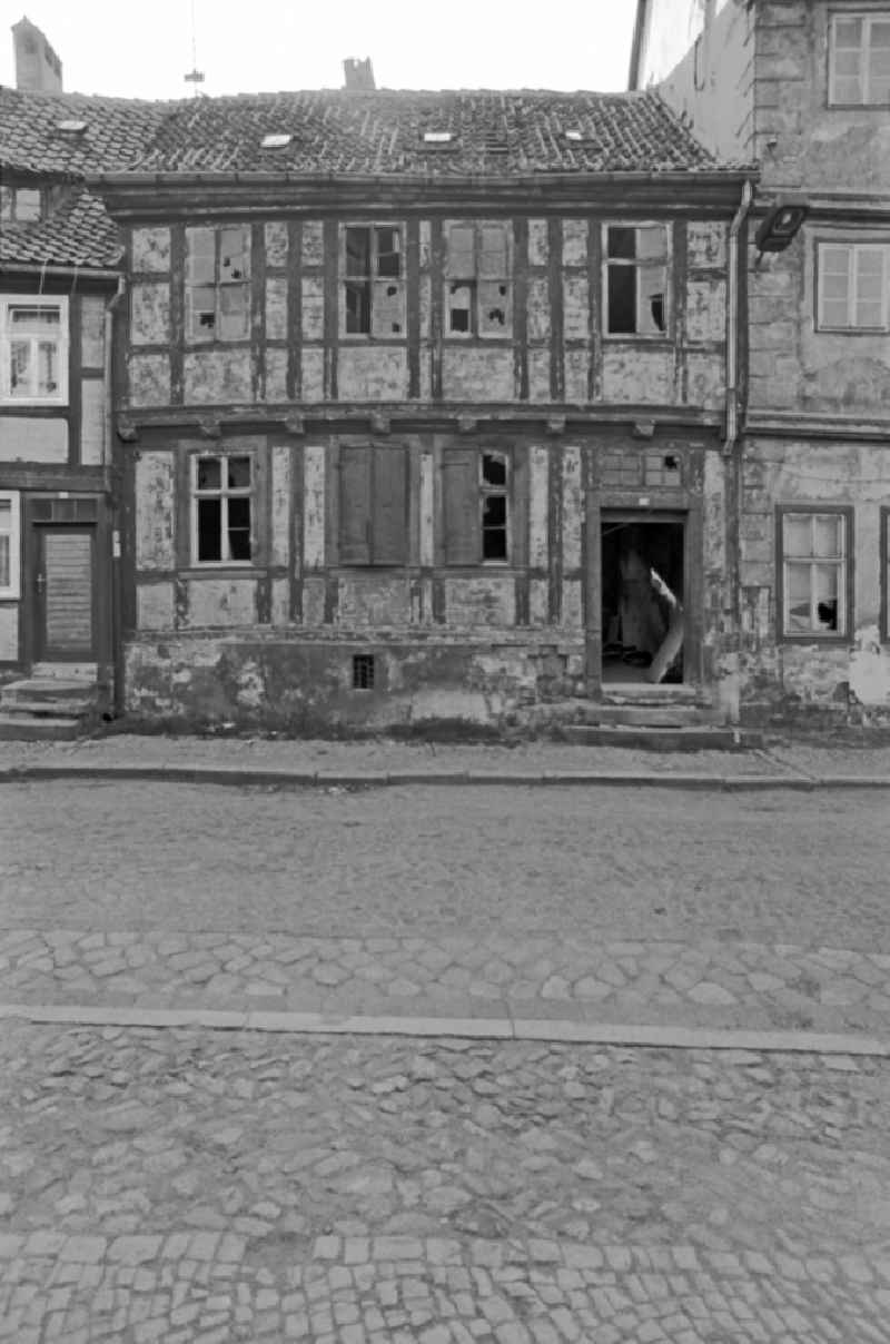 Rubble and ruins Rest of the facade and roof structure of the half-timbered house in Quedlinburg, Saxony-Anhalt on the territory of the former GDR, German Democratic Republic
