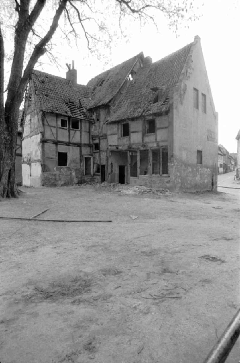 Rubble and ruins Rest of the facade and roof structure of the half-timbered house in the district Altstadt in Quedlinburg, Saxony-Anhalt on the territory of the former GDR, German Democratic Republic