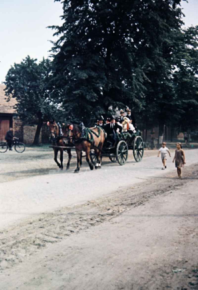 Wedding carriage and costumes and garments the Sorbian minority in Milkel in the state Saxony on the territory of the former GDR, German Democratic Republic