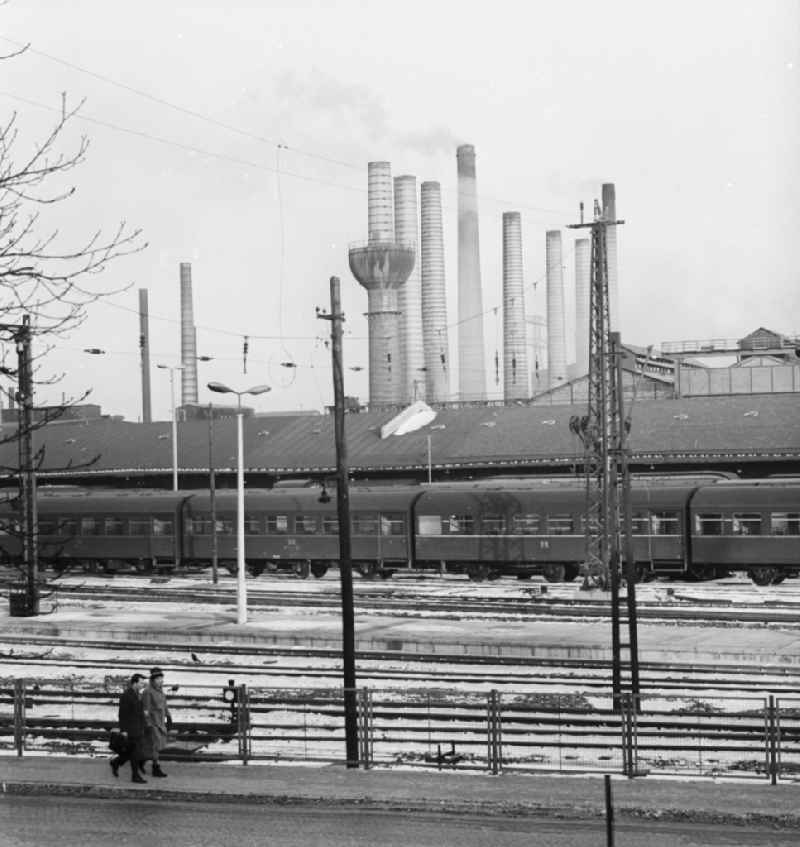 Overlooking the grounds of the Deutsche Reichsbahn in Riesa in Saxony in the area of the former GDR, German Democratic Republic. In the background the chimneys of the steelworks