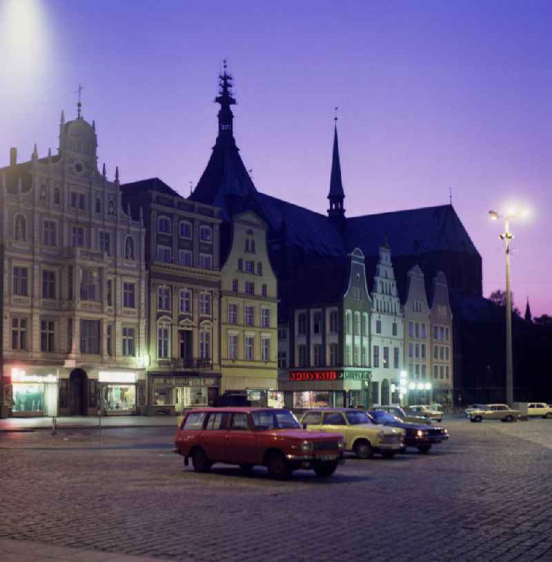 Street view of an apartment building - building front of historic gabled houses and town houses on the new market in Rostock in the state of Mecklenburg-Western Pomerania in the area of the former GDR, German Democratic Republic