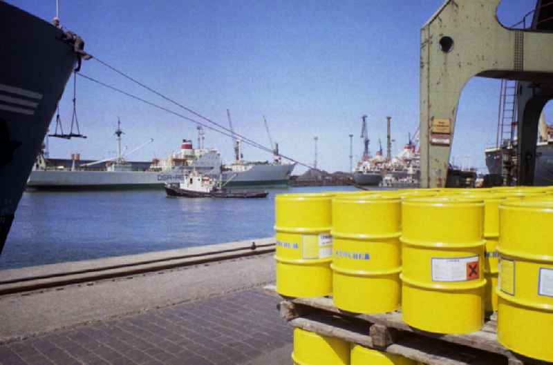 Barrels of the company Roche stand on the overseas port on the Warnow river in Rostock in the state Mecklenburg-Western Pomerania on the territory of the former GDR, German Democratic Republic