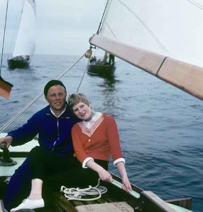 Young couple sailing on the Baltic Sea near Rostock, Mecklenburg-Western Pomerania in the territory of the former GDR, German Democratic Republic