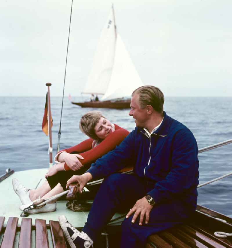 Young couple sailing on the Baltic Sea near Rostock, Mecklenburg-Western Pomerania in the territory of the former GDR, German Democratic Republic