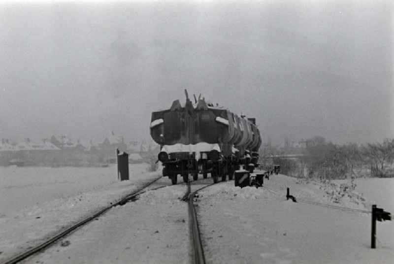 Freight lime train of the Deutsche Reichsbahn on the line in Ruebeland in the state Saxony-Anhalt on the territory of the former GDR, German Democratic Republic
