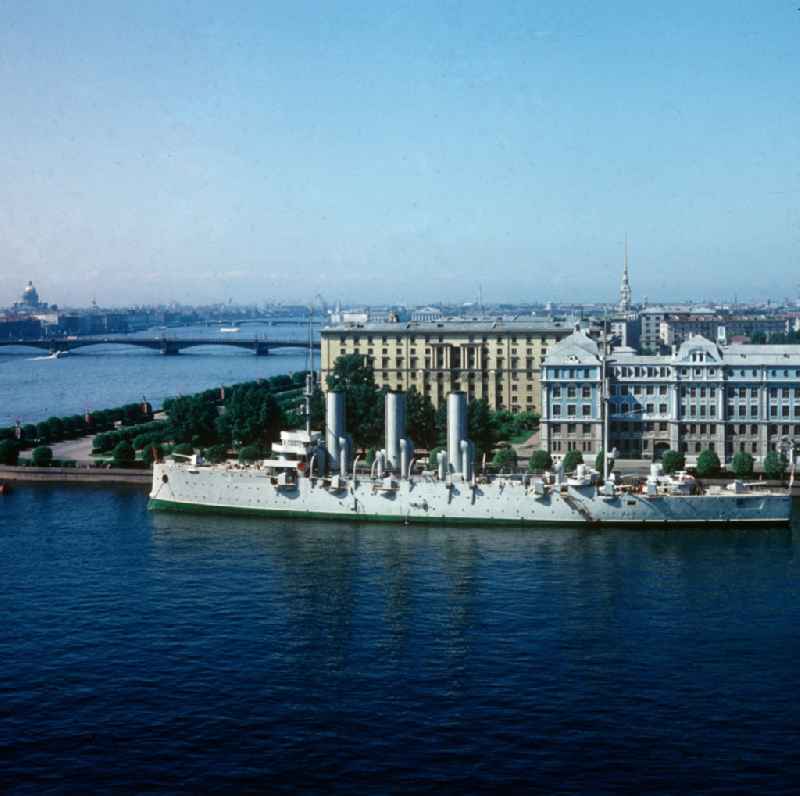 The Aurora at berth in front of the Cadet Academy in St. Petersburg, Russia - Soviet Union - USSR. The Aurora is a warship of the former Imperial Russian Navy and is since 1956 as a museum ship in St. Petersburg - Leningrad. The ship is valid under the name armored cruiser Aurora as a symbol of the October Revolution