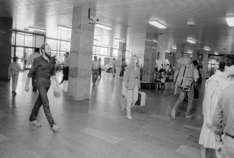 Traveller in the foyer in the railway station airport Berlin-Schoenefeld in Schoenefeld in the federal state Brandenburg in the area of the former GDR, German democratic republic