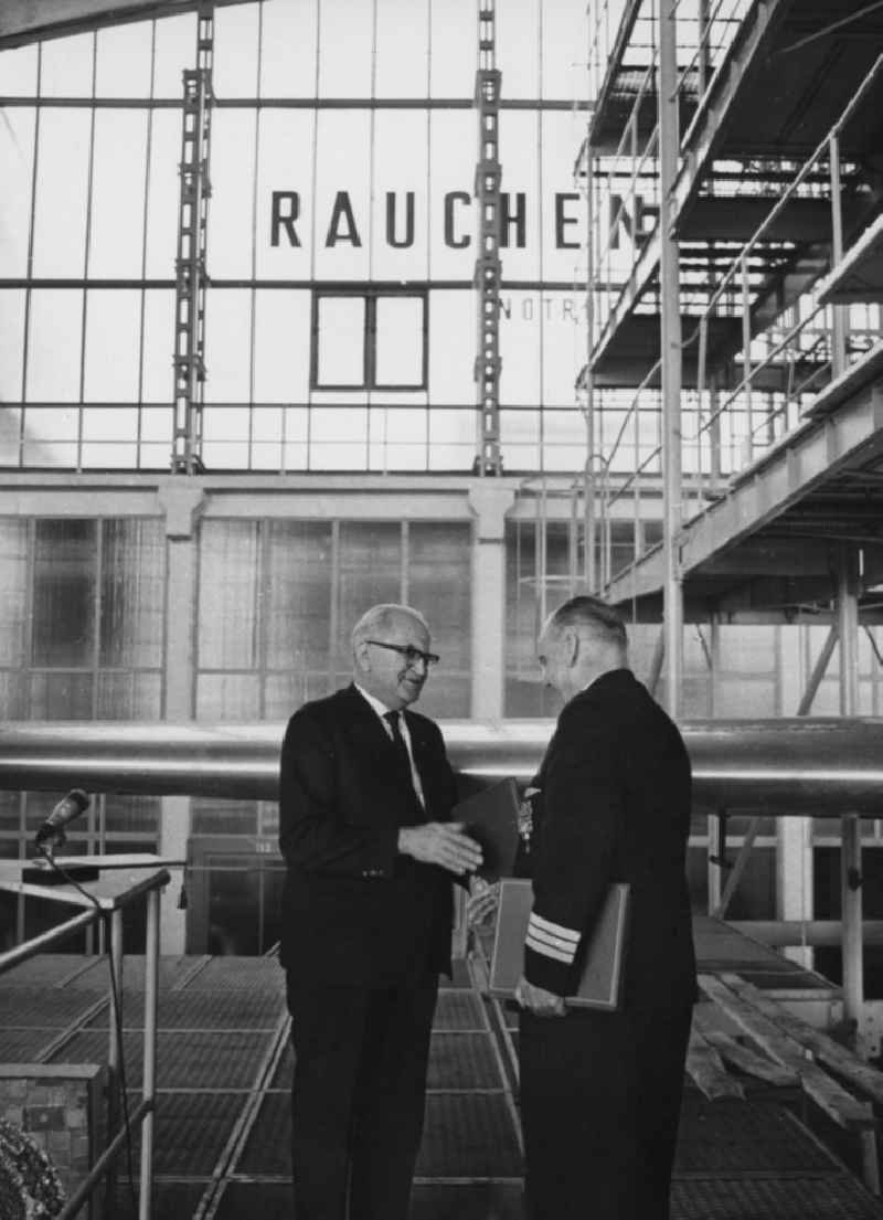 The Principal Director of Deutsche Lufthansa Arthur Pieck in conversation with the Minister of Transport Dr. Erwin Kramer in a hangar at Schoenefeld in what is now the state of Brandenburg