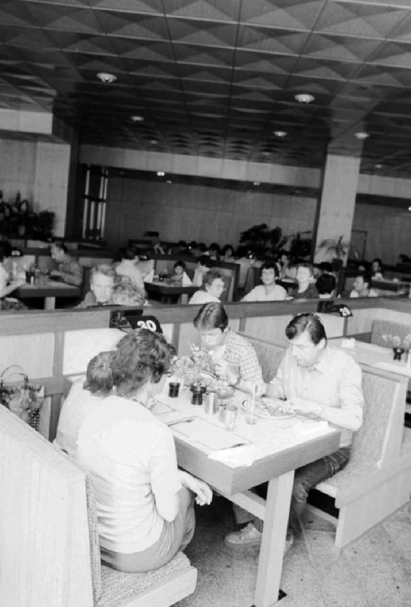 Traveller in the restaurant in the railway station airport Berlin-Schoenefeld in Schoenefeld in the federal state Brandenburg in the area of the former GDR, German democratic republic