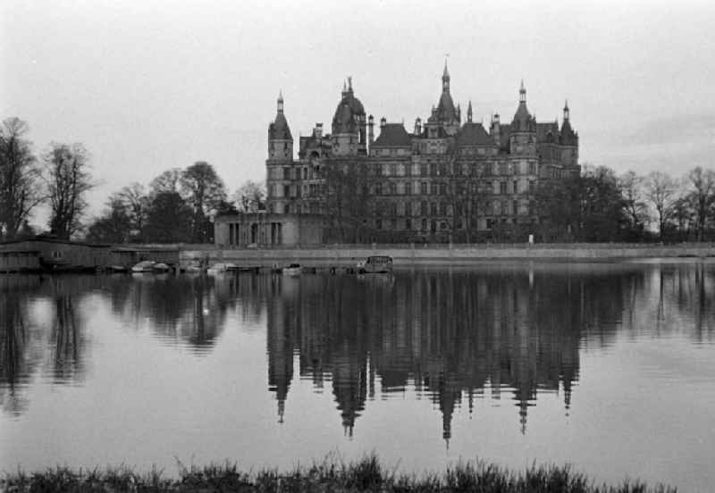 Palace with reflection in the water on street Lennestrasse in Schwerin, Mecklenburg-Western Pomerania on the territory of the former GDR, German Democratic Republic