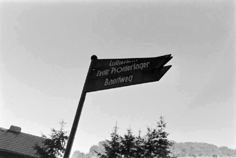 Signpost with the inscription ' Lutherbuche, Zentr. Pionierlager und Bandweg ' in Stolberg (Harz) South Harz in the federal state Saxony-Anhalt on the territory of the former GDR, German Democratic Republic