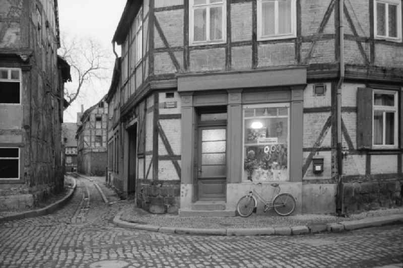 Entrance area and shop window of a retail storefor meat products on street Unter dem Turm in Seeland, Saxony-Anhalt on the territory of the former GDR, German Democratic Republic