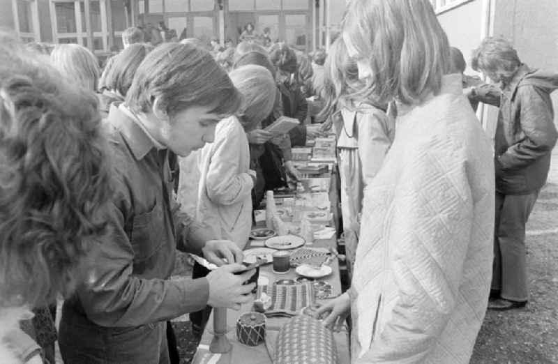 Auction and book bazaar on a schoolyard in Spremberg in the federal state of Brandenburg on the territory of the former GDR, German Democratic Republic