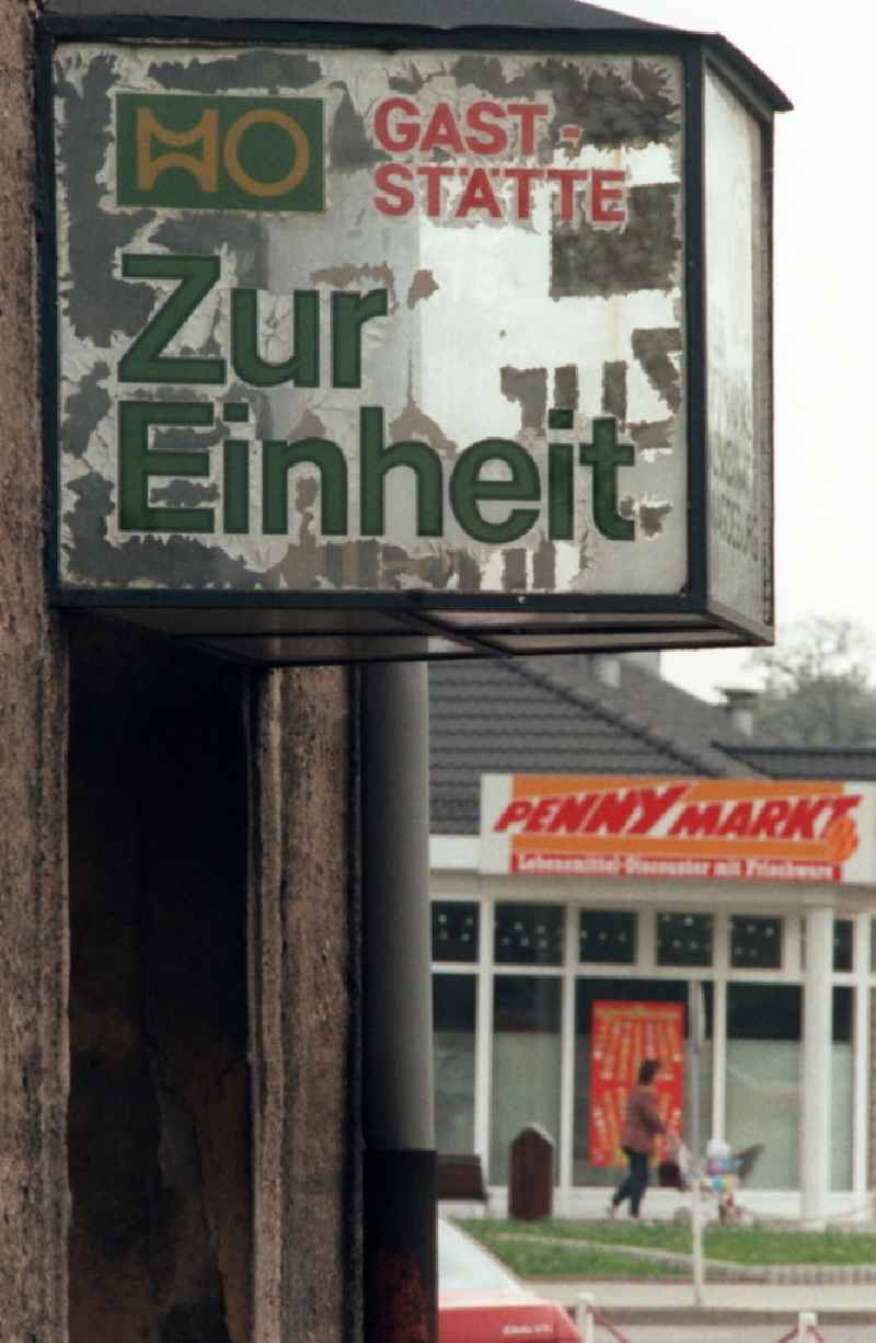 Advertising sign for a former HO restaurant 'Zur Einheit' in Stassfurt in the state of Saxony-Anhalt in the area of the former GDR, German Democratic Republic