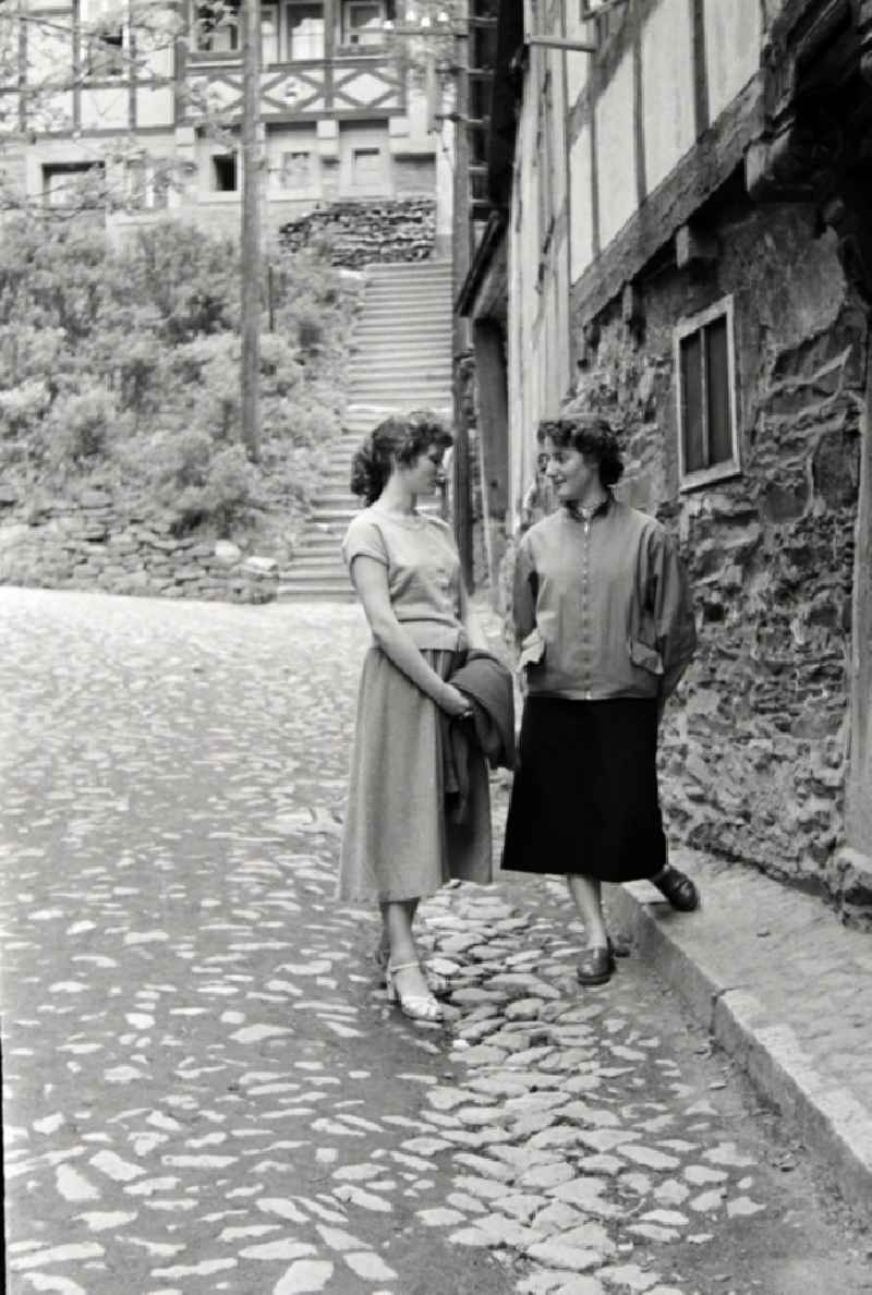 Fashion and clothing of street passers-by young women in Stolberg (Harz) in the state Saxony-Anhalt on the territory of the former GDR, German Democratic Republic
