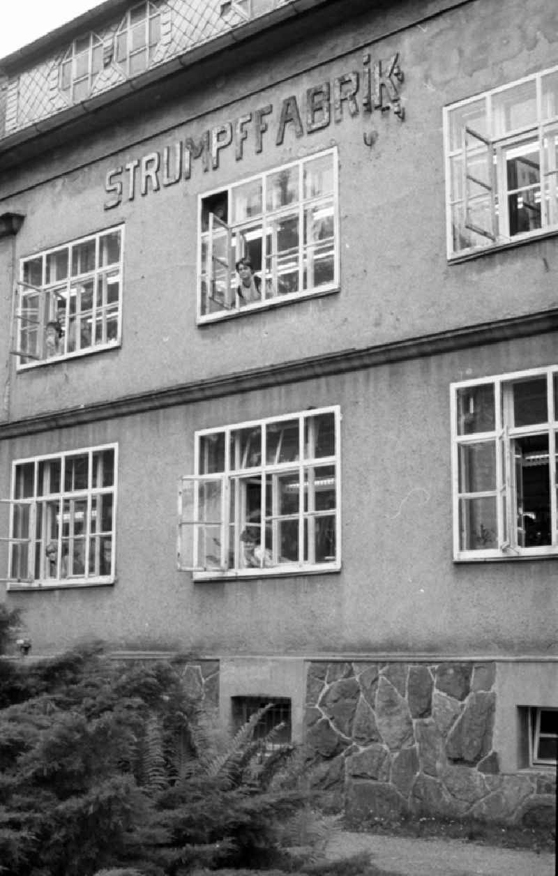 Outside - facade of the women's company of the stocking factory for the production of nylon - women's stockings as VEB fine stockings Esda in Thalheim in the Ore Mountains in the state of Saxony on the territory of the former GDR, German Democratic Republic