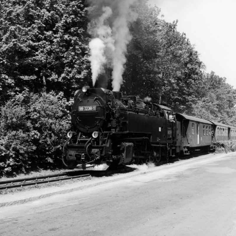 DR steam locomotive 99 7238-1 of Harzquerbahn in Wernigerode in Saxony-Anhalt on the territory of the former GDR, German Democratic Republic. The Harzquerbahn combines a narrow-gauge railway in meter gauge the cities Nordhausen in Thuringia and Wernigerode in Saxony-Anhalt. The single-track, non-electrified route through the Harz in north-south direction. Operators are the Harz narrow gauge railways GmbH (HSB)